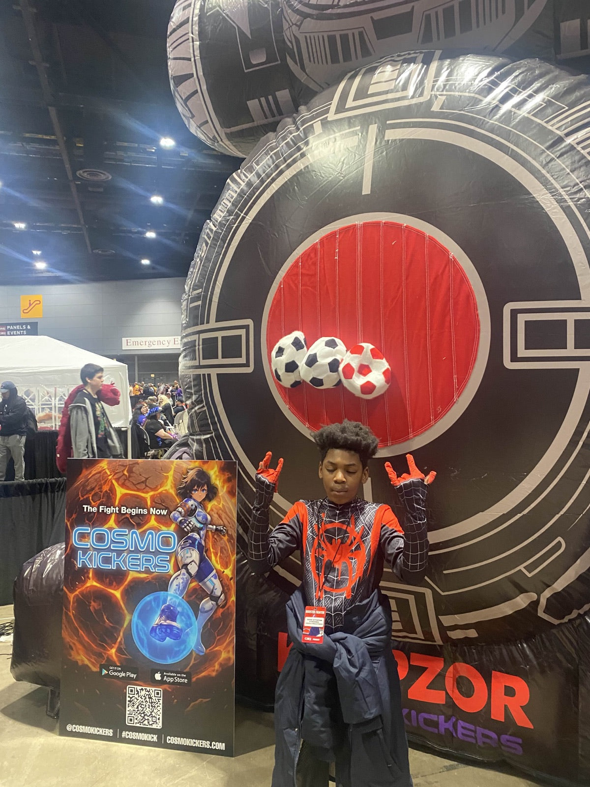 Child playing Boss Fight Targets at a convention booth